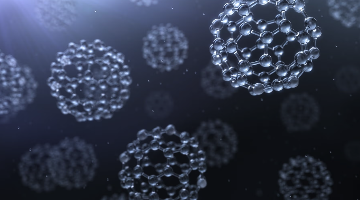 An illustration of nanoparticles, which look like molecular structures in the shapes of spheres.